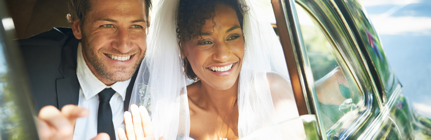 man and woman smile after getting married