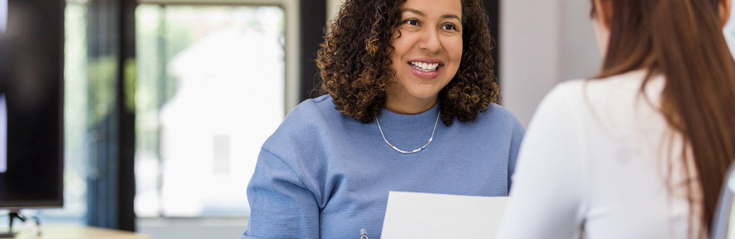 Woman holds paper with new employee