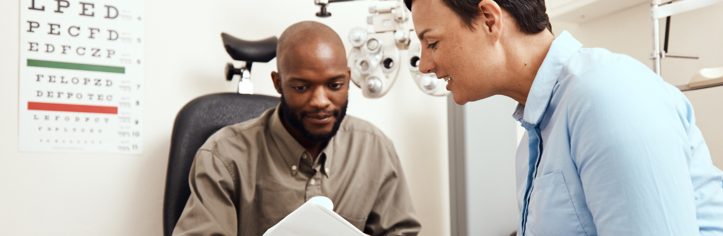 Eye doctor reviews results with pateint