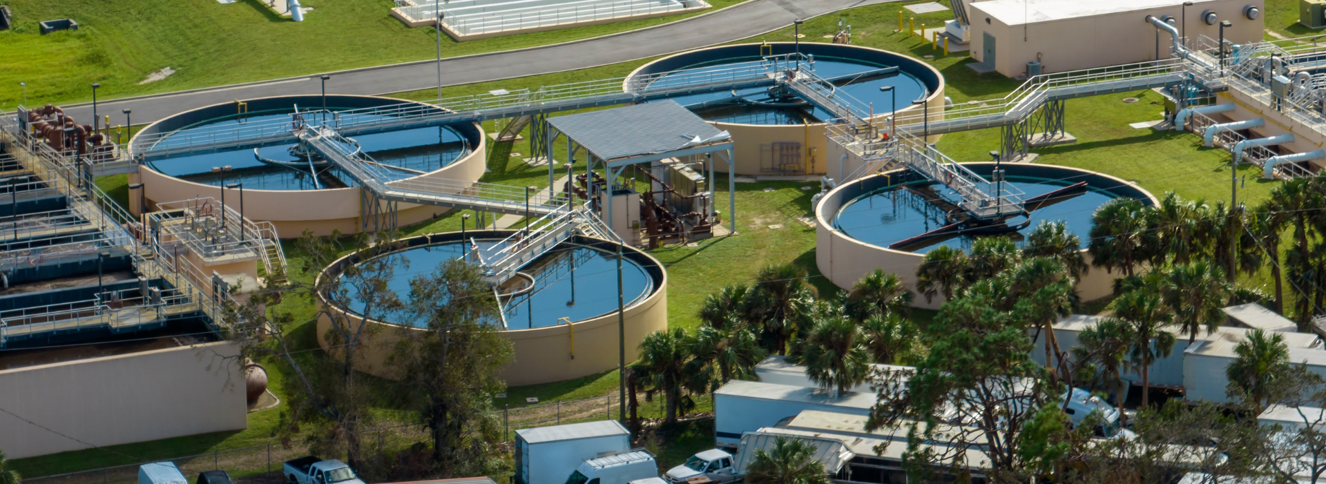 Aerial view of modern water cleaning facility at urban wastewater treatment plant. Purification process of removing undesirable chemicals, suspended solids and gases from contaminated liquid.