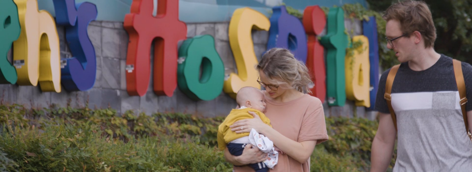 Anderson family walks outside of children's hospital