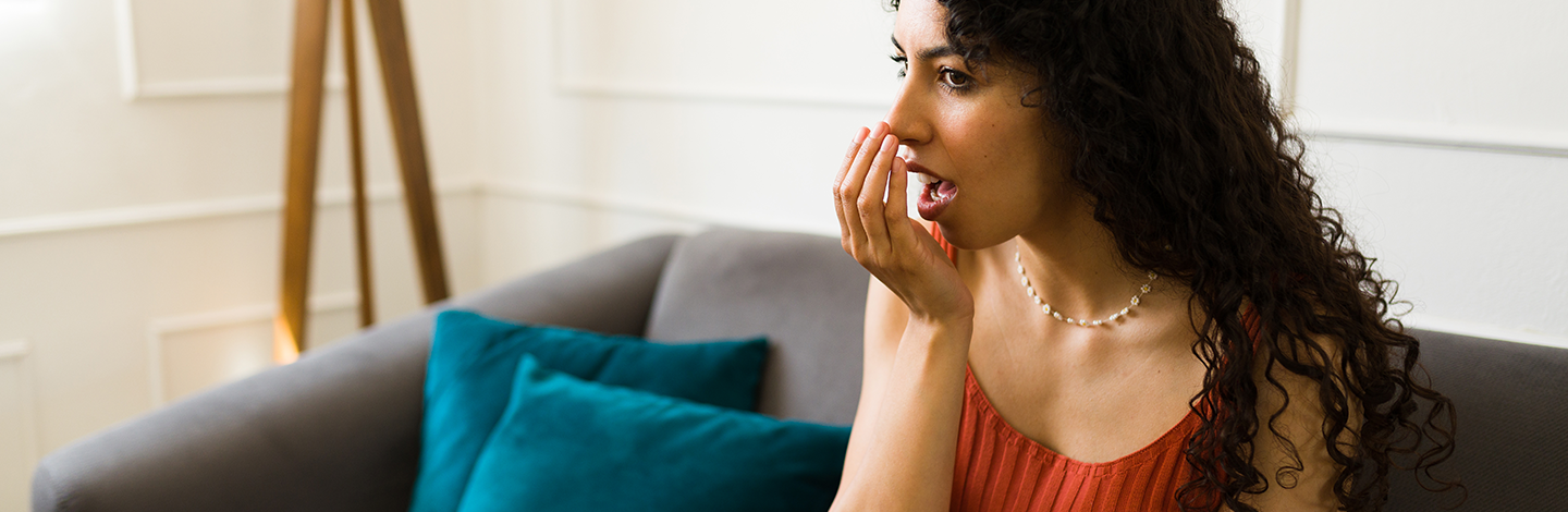woman realizes she has bad breath
