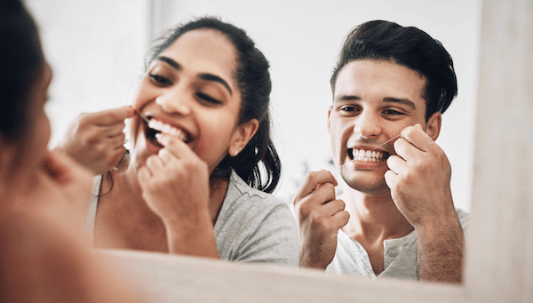 couple-flossing-in-mirror-1200x683 couple-flossing-in-mirror-1200x683