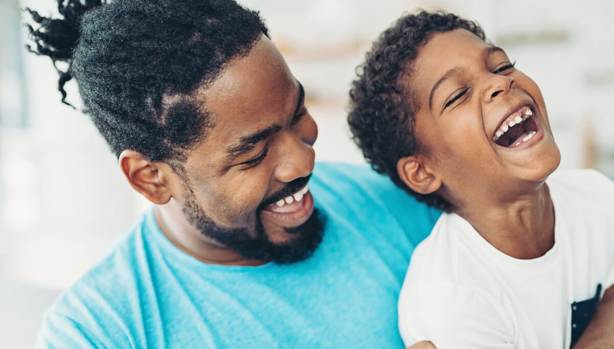 father-and-son-laughing-1200x683