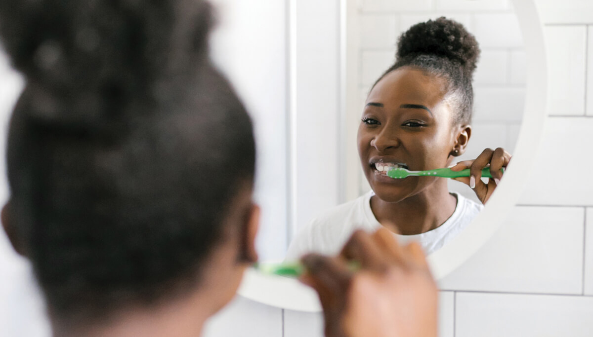 girl-brushing-teeth-in-mirror-1200x683 girl-brushing-teeth-in-mirror-1200x683