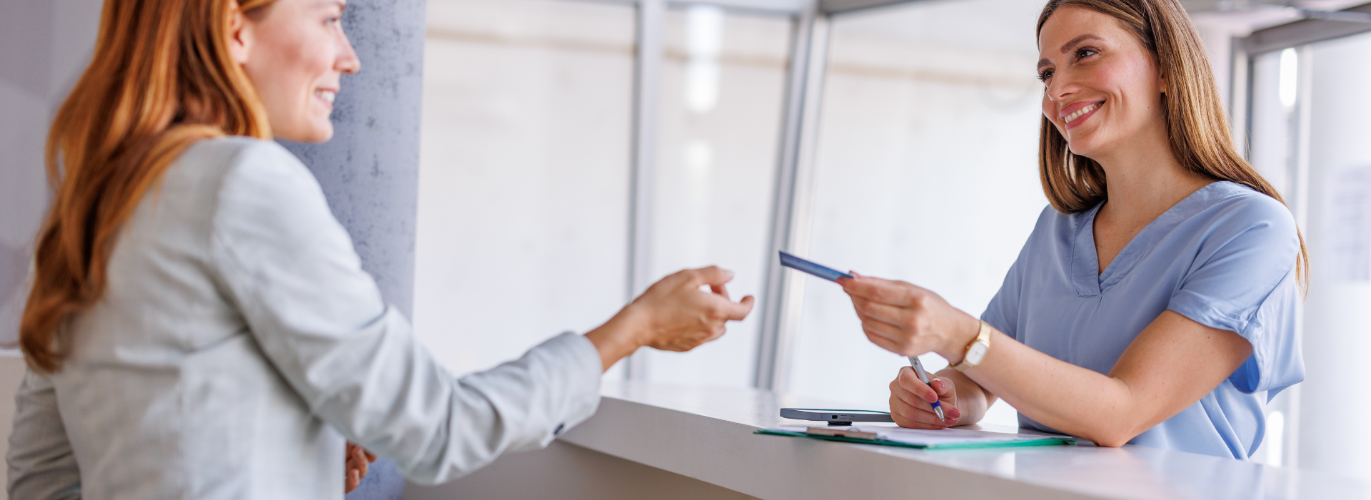 patient shows insurance card at check-in