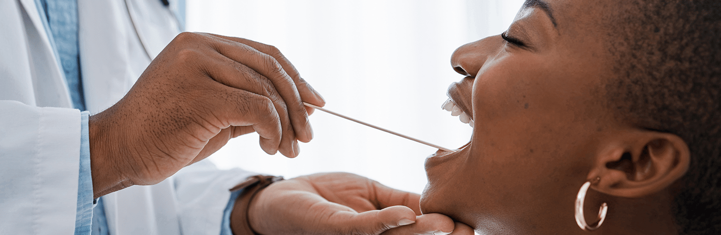 Woman gets mouth checked by dentist