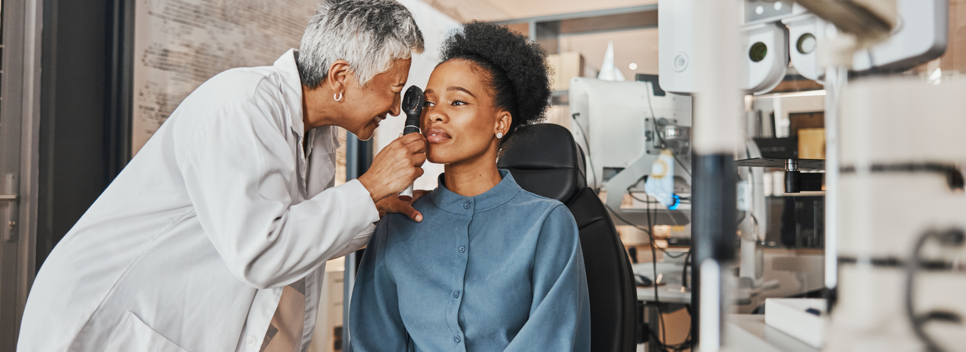 doctor checks woman's eye health