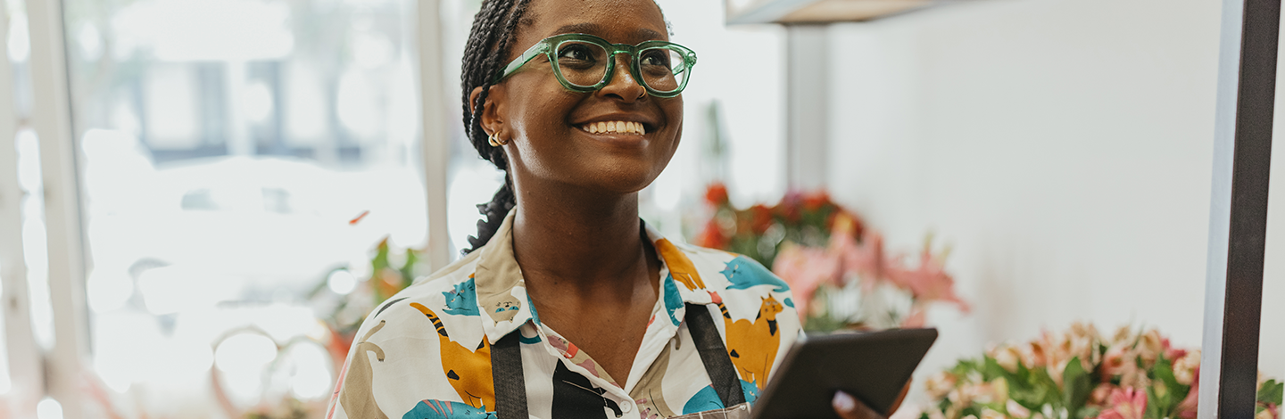 Business owner smiles while working